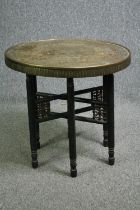 A C.1900 Syrian brass topped folding table. H.59 Dia.59cm.