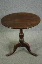 Occasional or lamp table, Georgian mahogany with tilt top action. H.70 Dia.69cm.