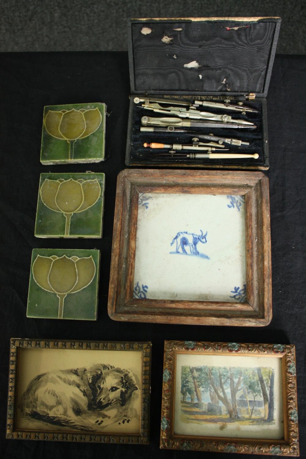 Three 19th century Art Nouveau tiles, three framed decorative tiles and a cased geometry set. L.