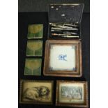 Three 19th century Art Nouveau tiles, three framed decorative tiles and a cased geometry set. L.