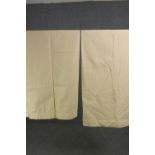 A pair of cream fully lined net design cotton mix curtains. L.140 W.120cm. (each).