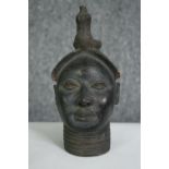 A Benin bronze style bust of a woman. H.22cm.