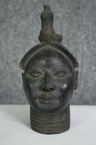 A Benin bronze style bust of a woman. H.22cm.