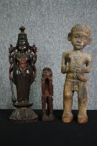 A carved Eastern hardwood figure of a goddess, an African carving and a central American carved
