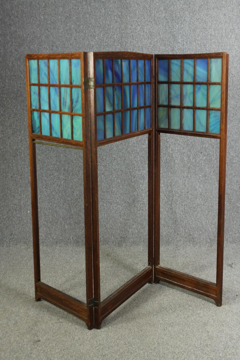 An oak and glass panelled Arts and Crafts folding room divider, early 20th century. H.141 W.160cm. - Image 2 of 4