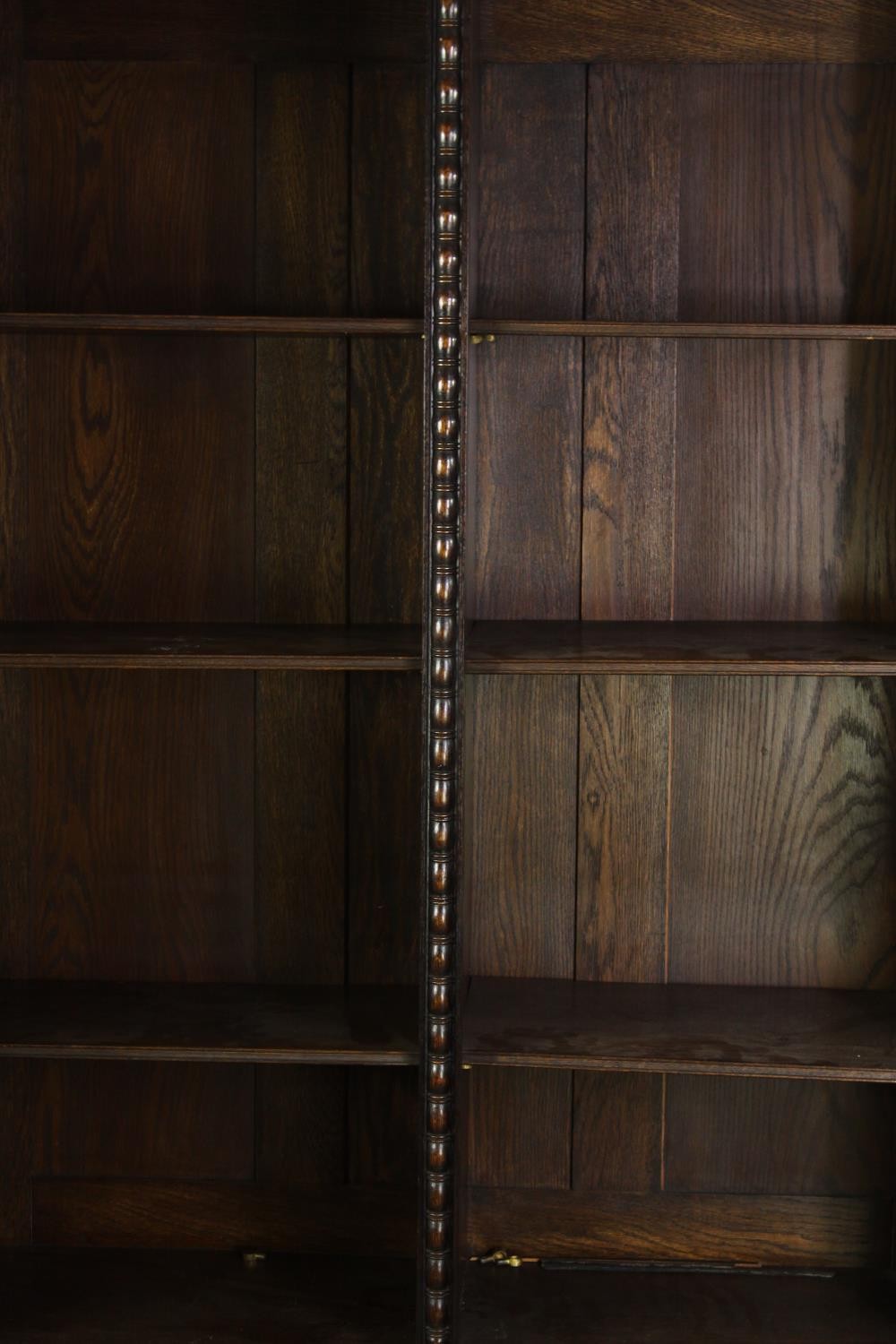 An oak bookcase, mid 20th century, one glass pane is missing. H.209 W.115 D.36cm. - Image 5 of 8