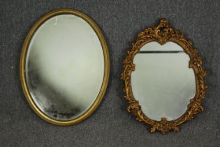 Two oval Georgian style giltwood and gesso mirrors, H.65 W.50cm. (largest).