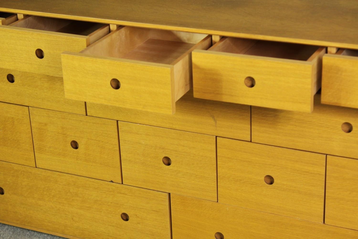 A contemporary light oak chest of drawers, H.73 W.150 D.48cm. - Image 6 of 7