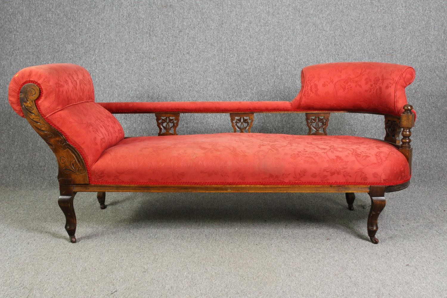 A late Victorian carved walnut chaise longue, with red damask upholstery, H.78 W.180 D.53cm. - Image 2 of 7