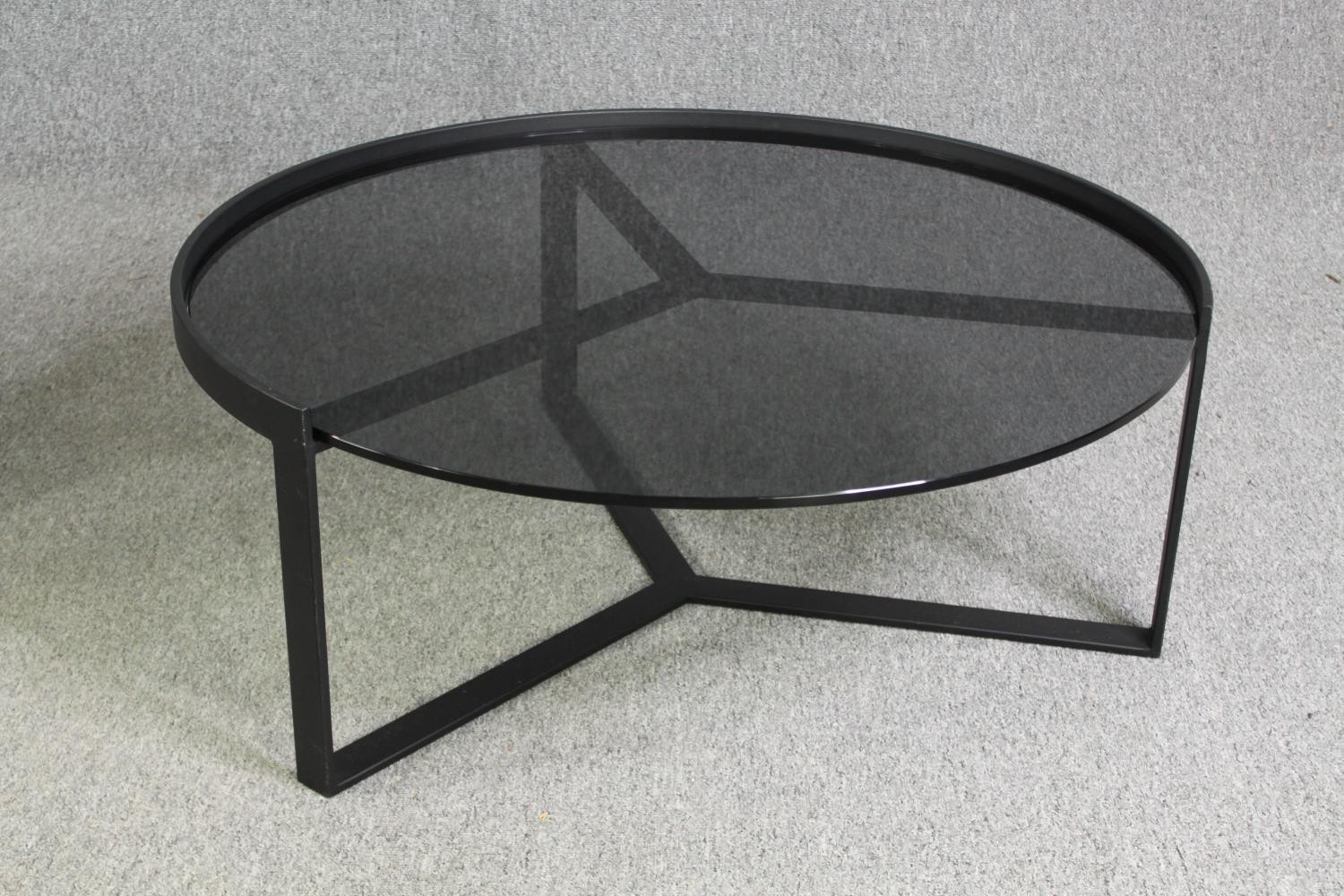 Two contemporary coffee tables with tinted glass tops and black metal supports. H.35 Dia.89cm. ( - Image 7 of 10