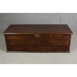 An Eastern hardwood and brass bound lidded coffer. H.50 W.150 D.60cm.