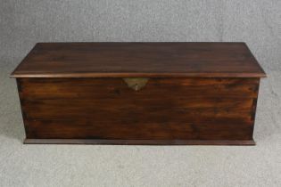 An Eastern hardwood and brass bound lidded coffer. H.50 W.150 D.60cm.