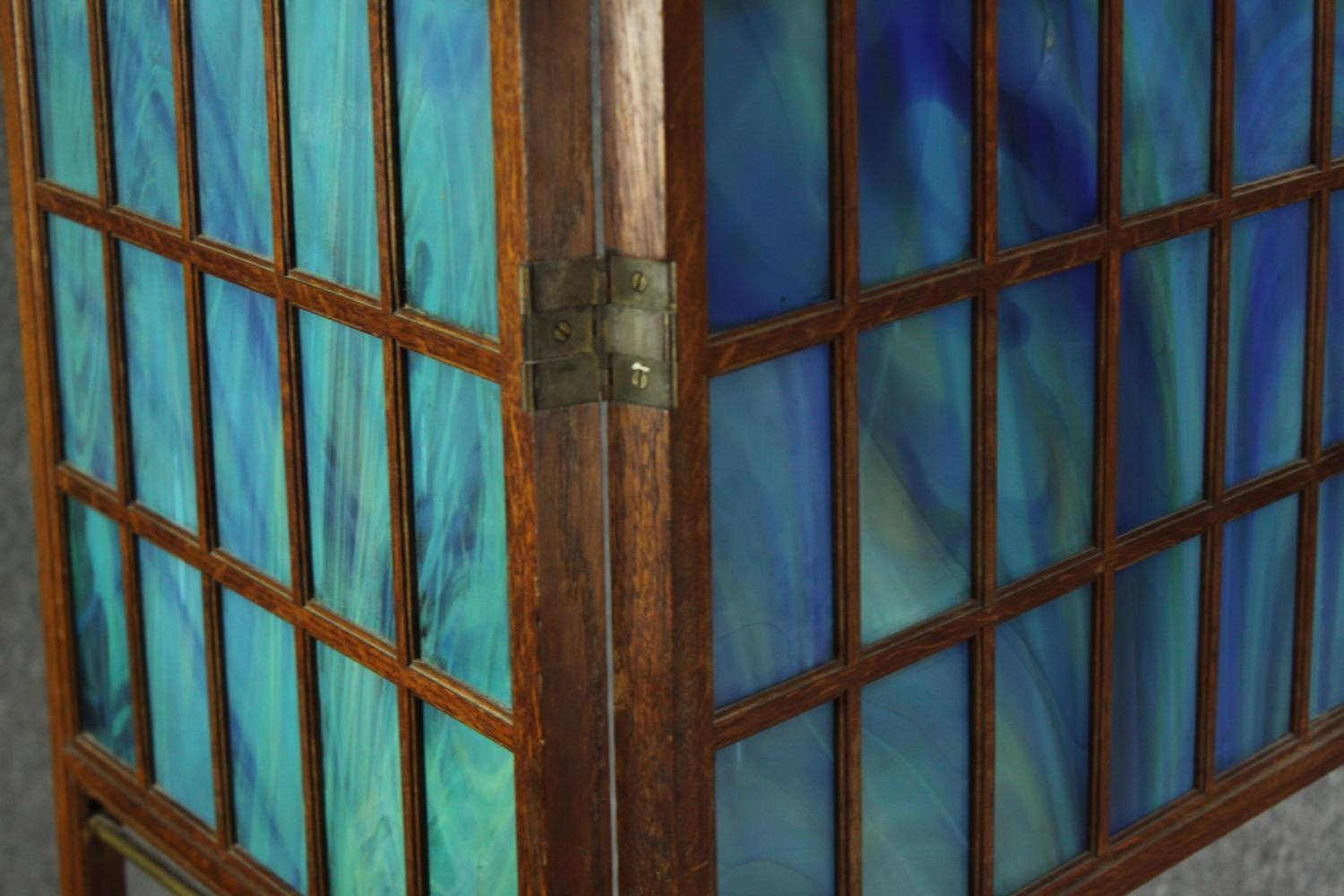 An oak and glass panelled Arts and Crafts folding room divider, early 20th century. H.141 W.160cm. - Image 4 of 4