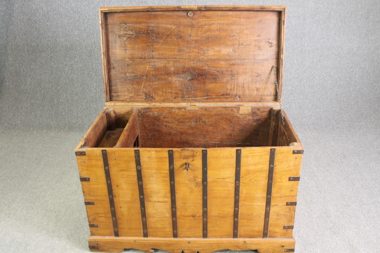 A continental pitch pine and metal bound lidded chest, probably 19th century, H.70 W.110 D.60cm. - Image 4 of 12