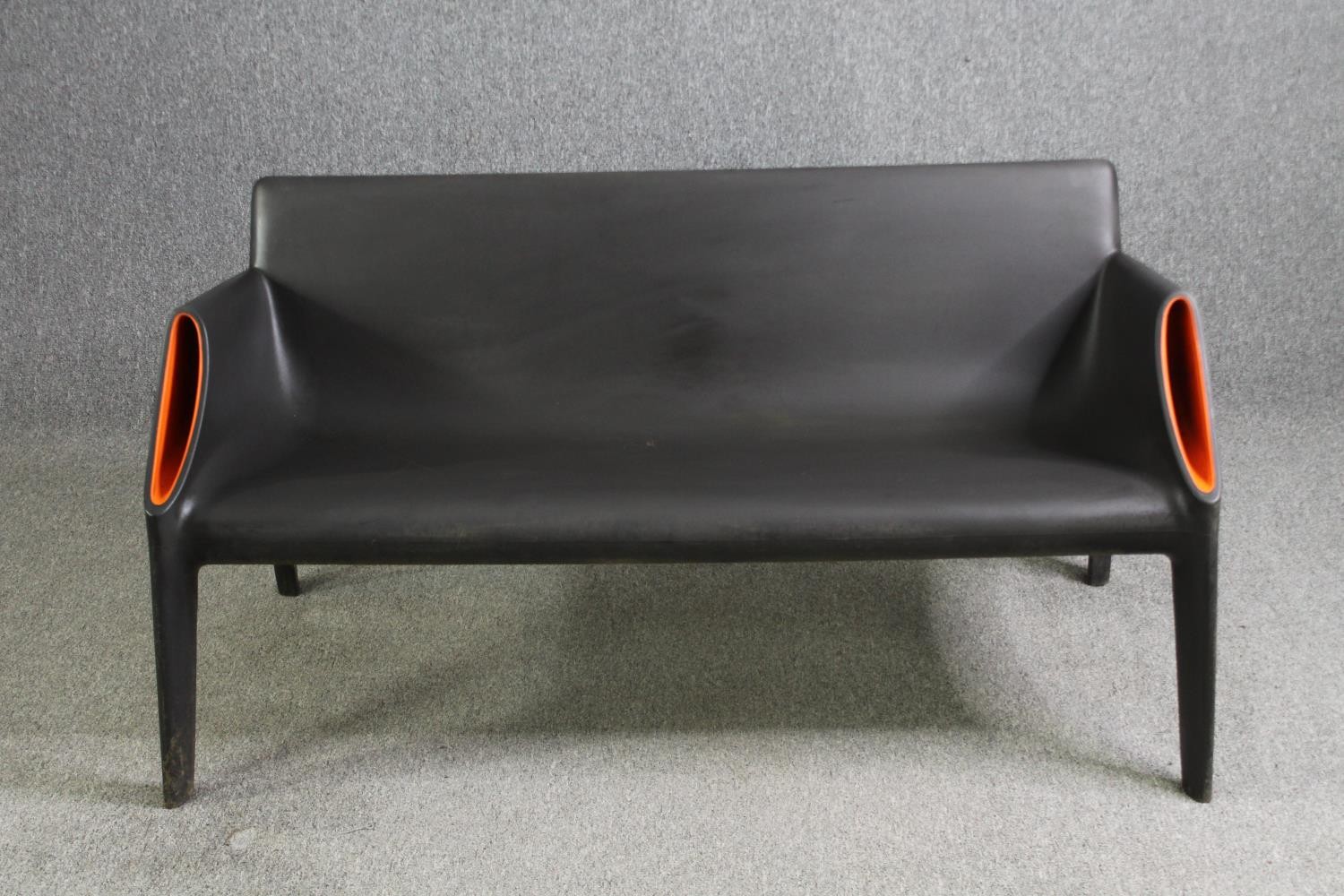 A Kartell Magic Hole garden bench by Philippe Starck. H.72 W.140 D.72cm.