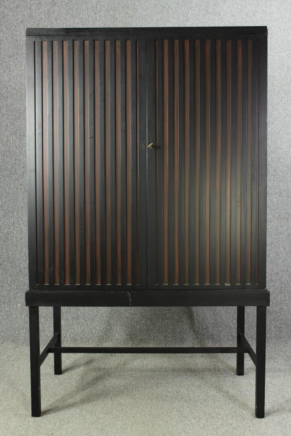 A contemporary ebonized cabinet on stand. H.169 W.102 D.60cm. - Image 4 of 7