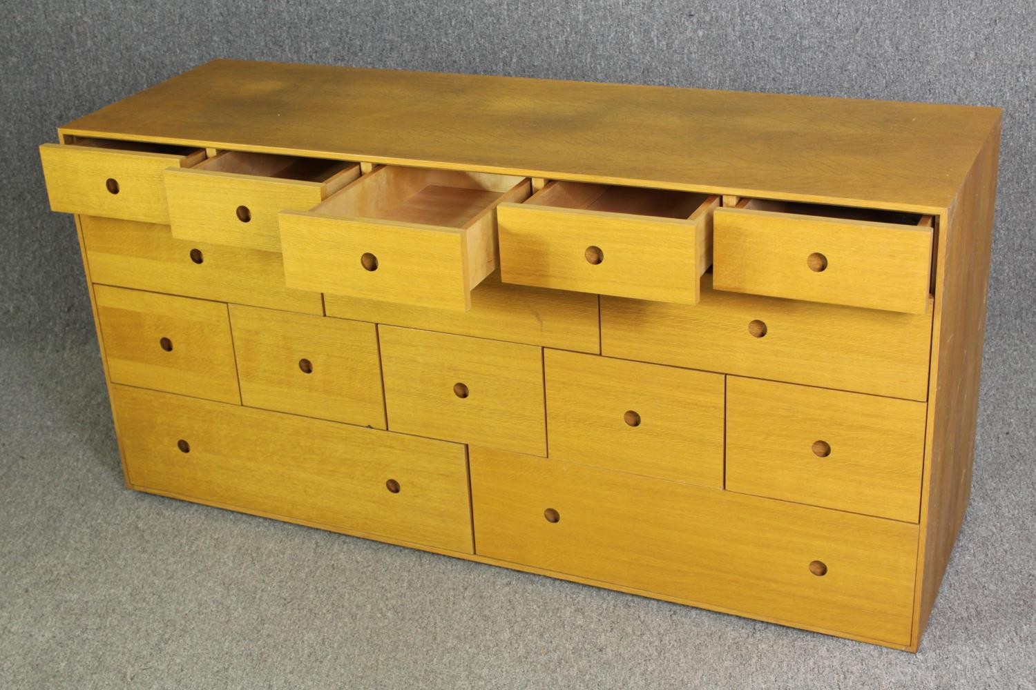 A contemporary light oak chest of drawers, H.73 W.150 D.48cm. - Image 5 of 7