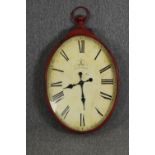 A vintage cafe style painted metal wall clock, H.85 W.57cm.