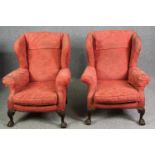 A pair of possibly 19th century carved mahogany Georgian style wingback armchairs. H.97cm. (each).
