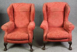 A pair of possibly 19th century carved mahogany Georgian style wingback armchairs. H.97cm. (each).