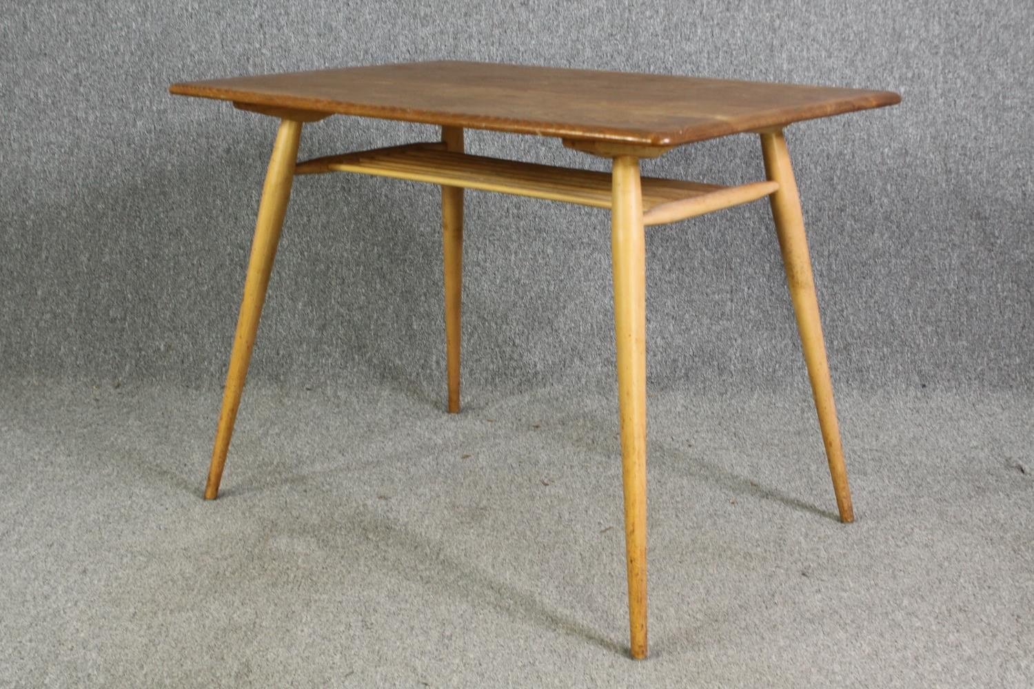 An Ercol light elm side table, with an undertier on beech supports. H.74 W.98 D.68cm. - Image 3 of 6