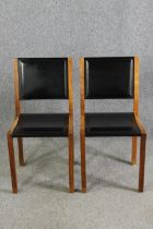 A pair contemporary Heal's teak and black leather dining chairs