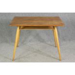 An Ercol light elm side table, with an undertier on beech supports. H.74 W.98 D.68cm.