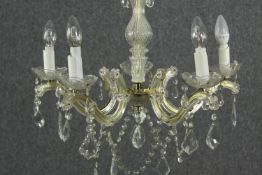 A 20th century five branch chandelier with crystal swags and drops. H.56 Dia.60cm.