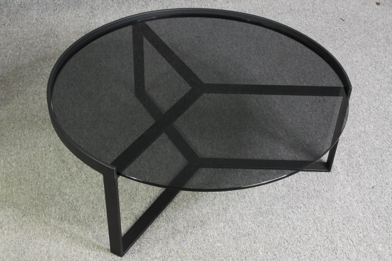 Two contemporary coffee tables with tinted glass tops and black metal supports. H.35 Dia.89cm. ( - Image 4 of 10