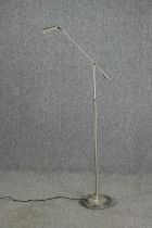 A floor standing chrome anglepoise style lamp. H.170cm.