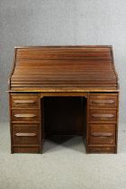 An oak roll top tambour fronted desk, early 20th century with maker's mark. H.128 W.126 D.76cm.