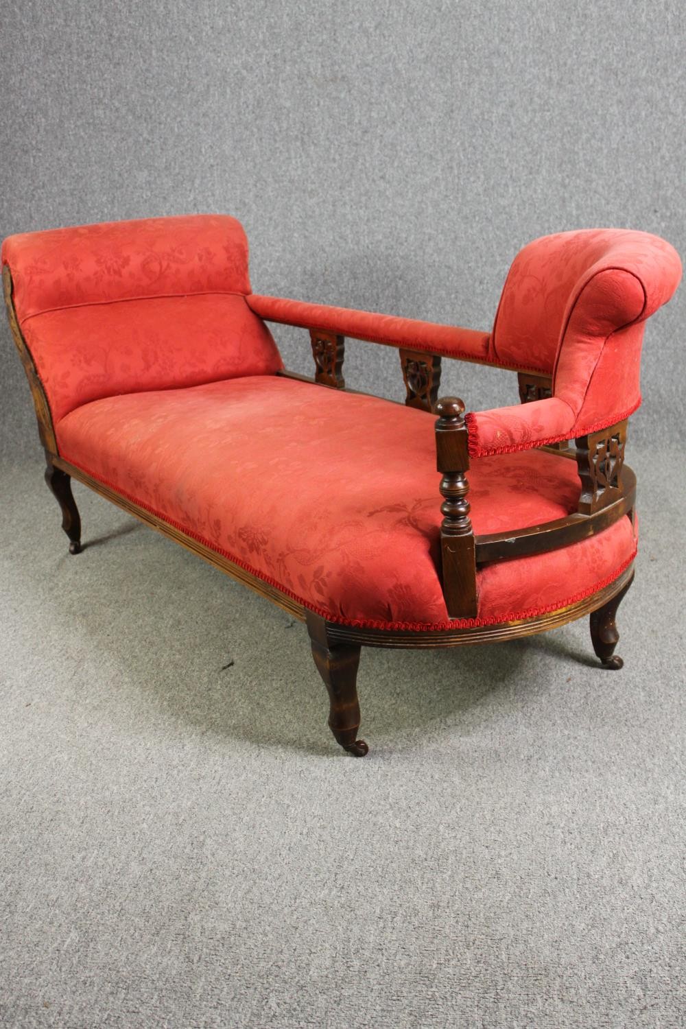 A late Victorian carved walnut chaise longue, with red damask upholstery, H.78 W.180 D.53cm. - Image 3 of 7