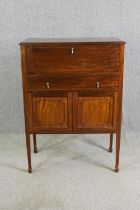 A mahogany cocktail cabinet, 20th century, in late Georgian style. H.122 W.88 D.48cm.