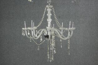An eight branch crystal chandelier with swags and drops. (needs repair) H.72 Dia.60cm.