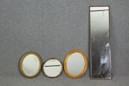 A group of four mirrors. H.120 W.32cm. (largest).