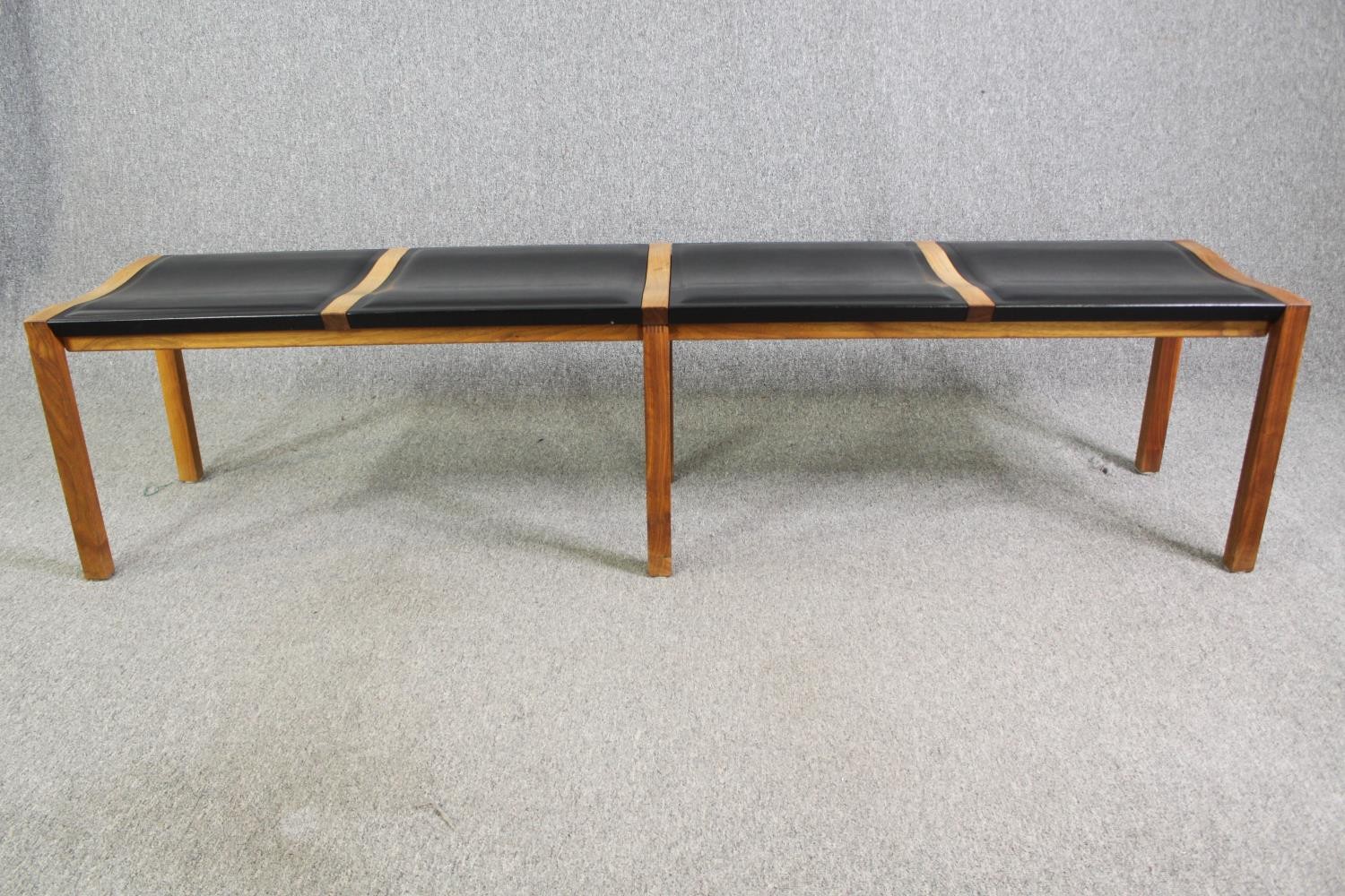 A pair of contemporary Heal's teak and black leather dining benches. H.48 W.200 D.45cm. (each). - Image 5 of 8