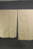 A pair of cream fully lined net design cotton mix curtains. L.140 W.120cm. (each).