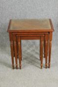 A nest of three mahogany tables with leather and glass inset tops H.58 W.53 D.40cm. (largest).