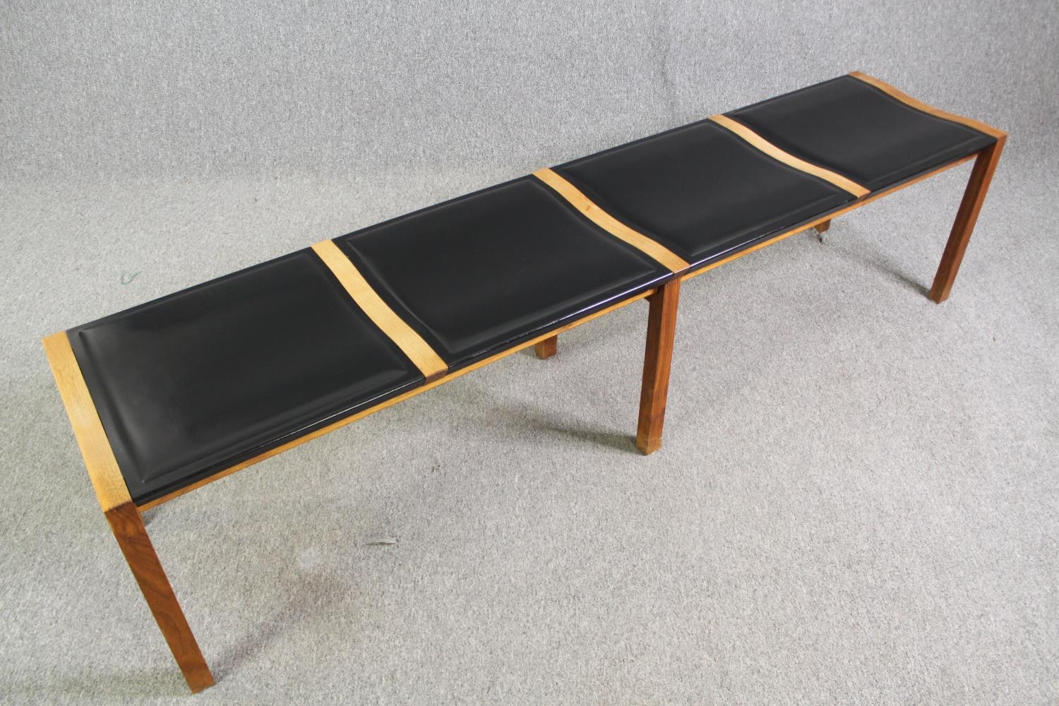 A pair of contemporary Heal's teak and black leather dining benches. H.48 W.200 D.45cm. (each). - Image 3 of 8