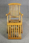 An oak folding steamer chair, first quarter 20th century, H.87 W.60 D.140cm.