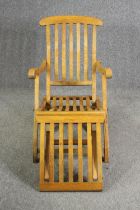 An oak folding steamer chair, first quarter 20th century, H.87 W.60 D.140cm.