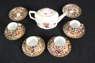 4 cups and 6 saucers of Crown Derby Imari and a Bali pattern teapot. H.11cm. (largest).
