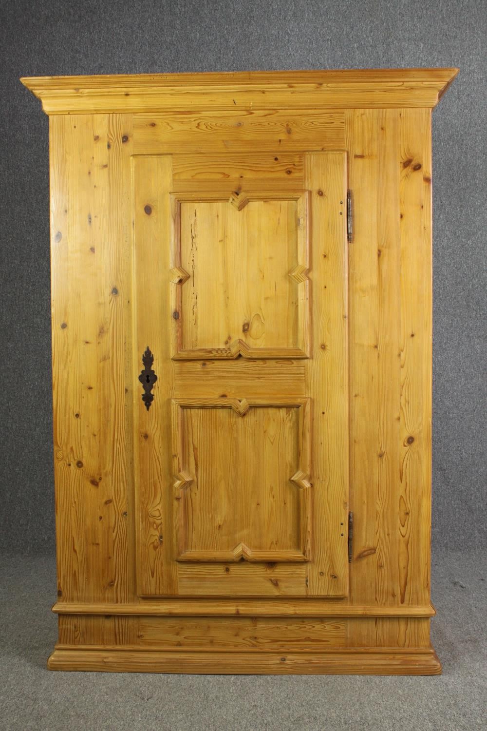 A continental pine hall cupboard or wardrobe. H.174 W.123 D.56cm.