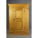 A continental pine hall cupboard or wardrobe. H.174 W.123 D.56cm.