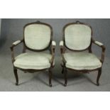 Armchairs, a pair, 19th century carved mahogany fauteuil on cabriole supports.