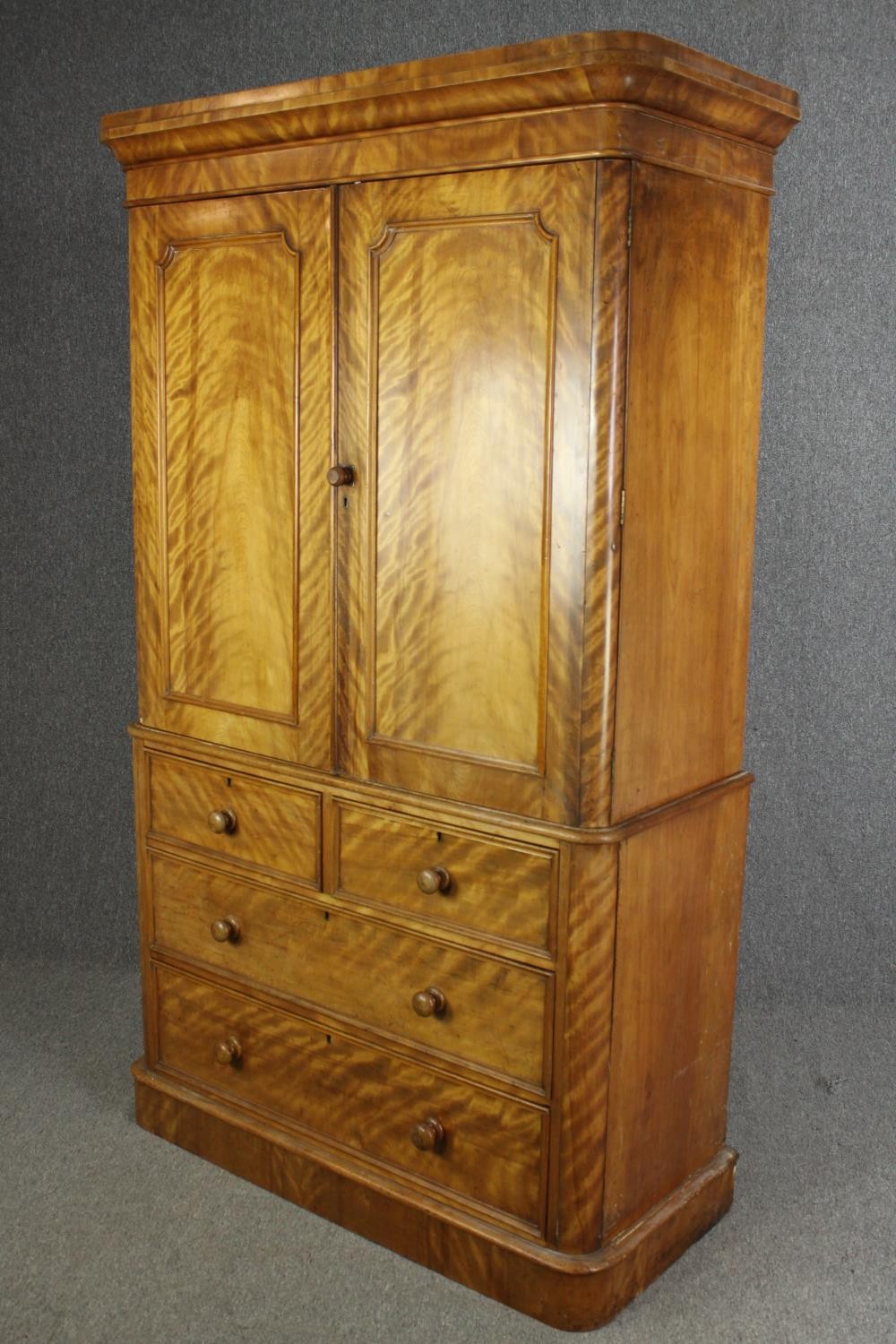 A Victorian satinwood linen press, fitted with slides above drawers on a plinth base. H.205 W.115 - Image 3 of 7