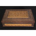 A Mah Jong set in a carved wooden case, with instructions, H.7 W.30 D.20cm.