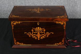 A Victorian rosewood and satinwood inlaid fitted stationery box, H.20 W.30 D.17cm. (largest).