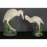 A pair of glazed earthenware wading birds, modern, H.64cm. (largest).