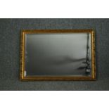 A contemporary gilt framed wall mirror. H.54 W.75cm.